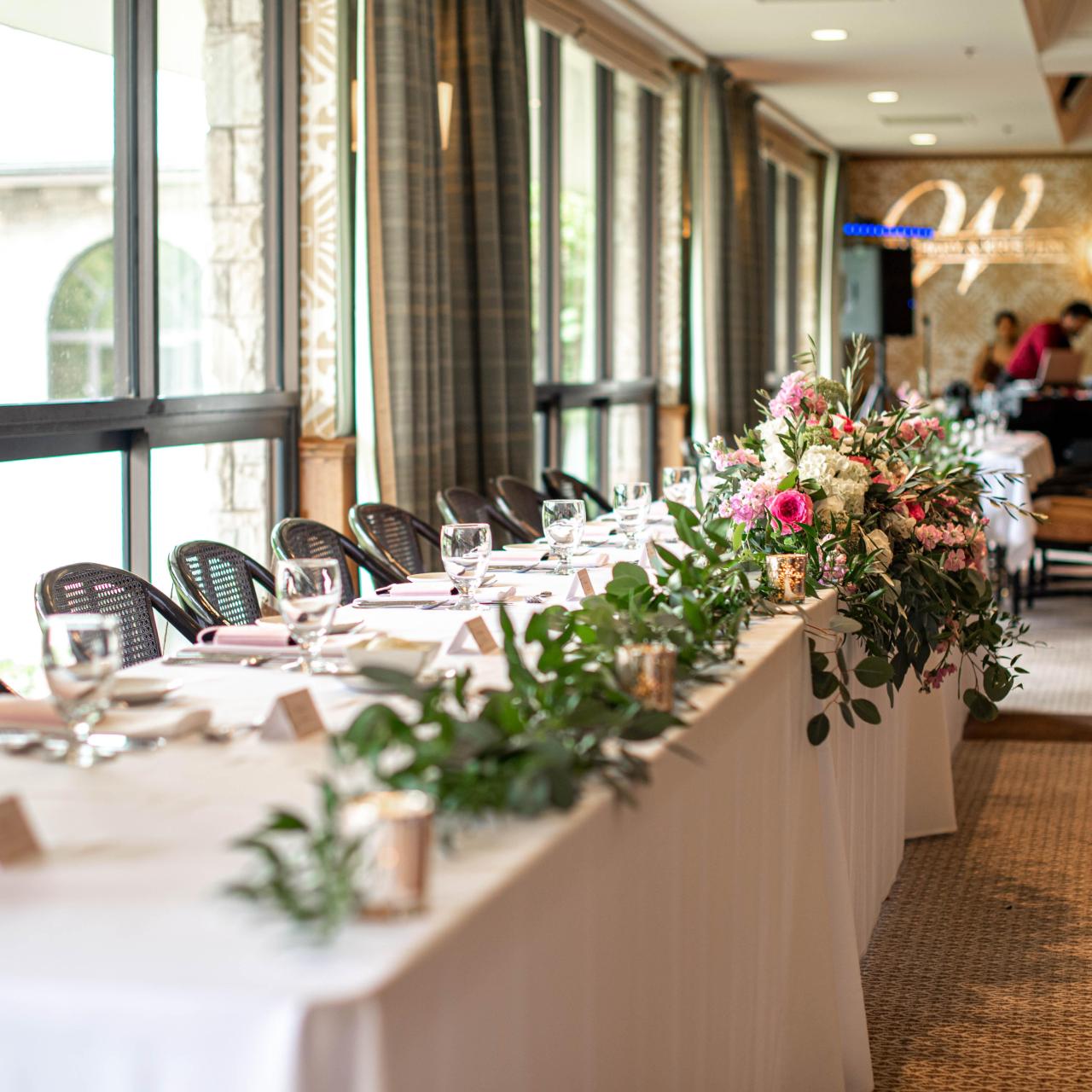 Wedding decorated table with elegant white and pink flowers. 